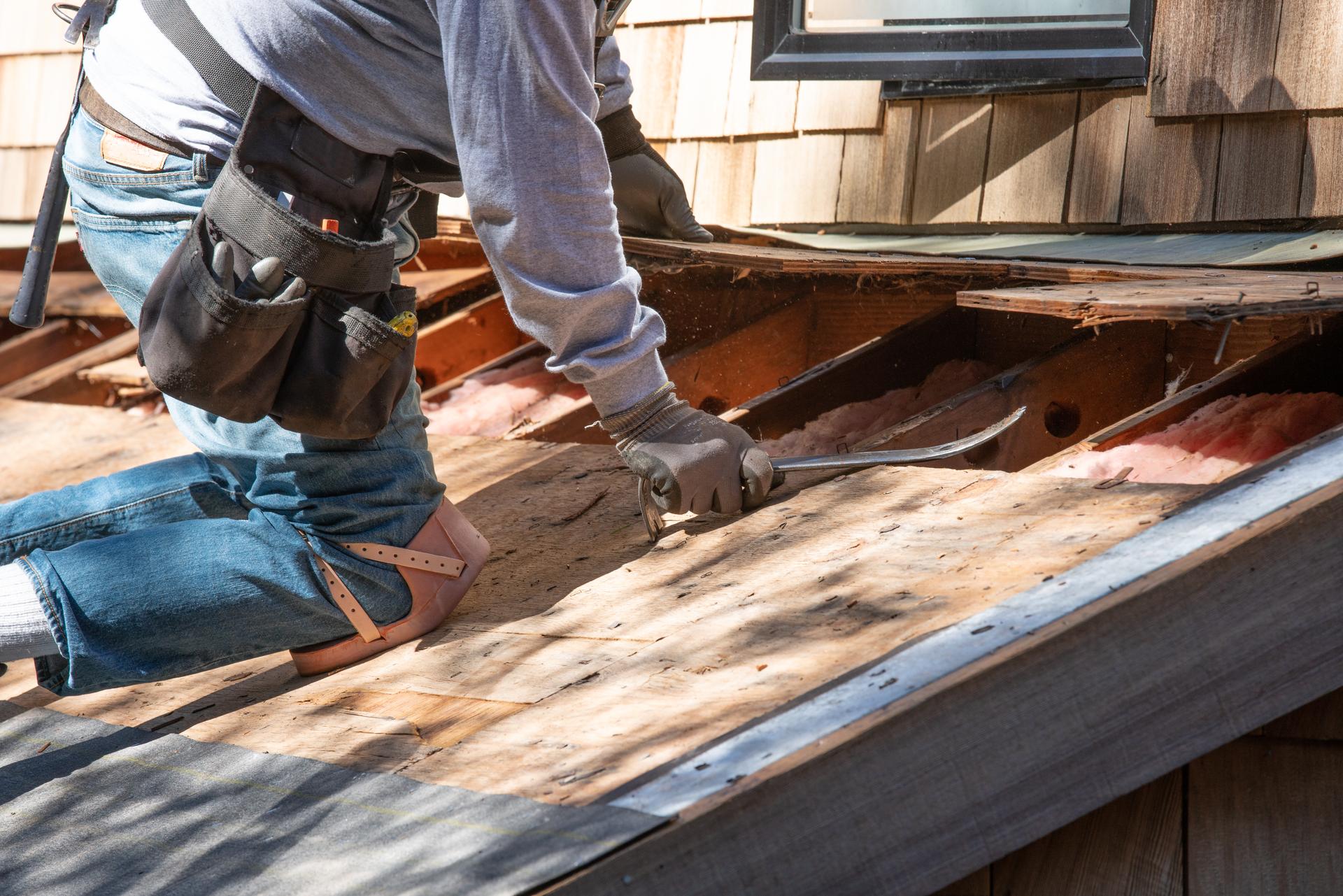 Roofer removing old roof